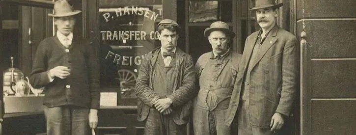 The founding Hansen family outside the P. Hansen Transfer Co. freight office, Seattle, c. 1890s